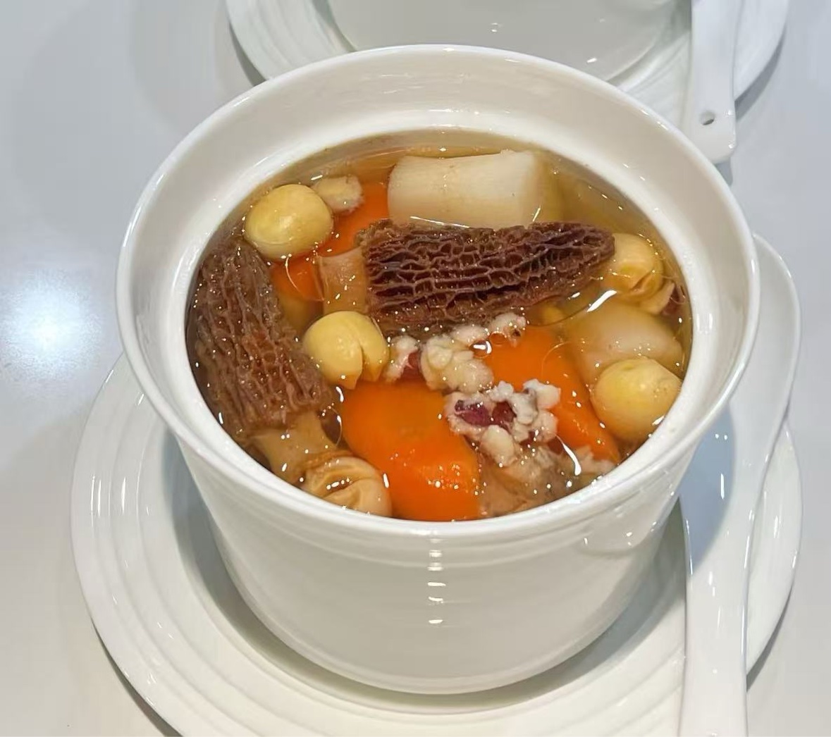 Warm nourishing soup served in a white bowl
